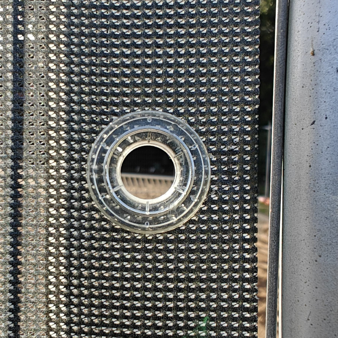 Close-up of a mesh banner plastic eyelet