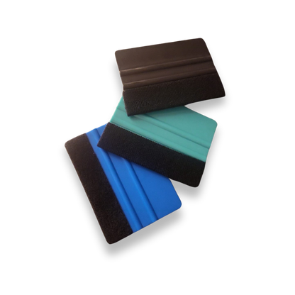 Three squeegees in black, blue, and green on a white background