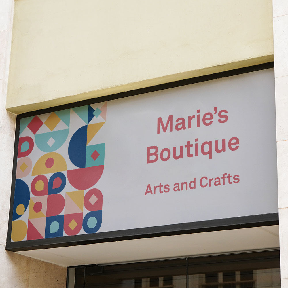 Signboard of Marie's Boutique with colorful geometric design on a building facade